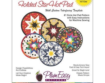 May include: A pattern for a Folded Star Hot Pad, with a custom interfacing template. The image shows five colorful, circular hot pads with star designs. The pattern includes easy instructions for machine sewing. The hot pads are 8 inches in diameter.