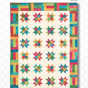 May include: A quilt pattern featuring a white background with a colorful patchwork design of stars and stripes. The pattern is titled "Stars & Stripes" and has the number ATK-139.