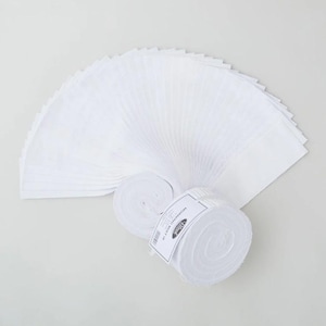 May include: A collection of white fabric squares, fanned out and rolled. The fabric is a solid white color. The rolls of fabric have a label that reads "Morning Mist" and a barcode.
