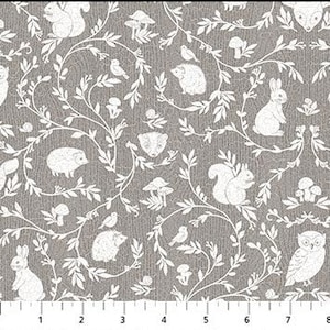 May include: Gray fabric with a white woodland pattern featuring squirrels, rabbits, hedgehogs, birds, mushrooms, and an owl. The design includes winding vines and leaves, creating a whimsical forest scene. The fabric has a textured appearance.