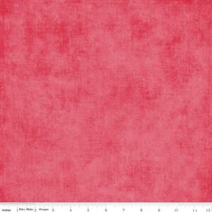 May include: A solid red fabric with a textured, slightly distressed look. The fabric has a subtle, uneven pattern throughout.