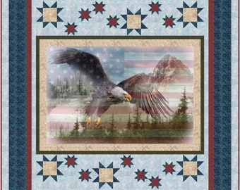 May include: A patriotic quilt featuring a bald eagle in flight against a backdrop of a mountain range and an American flag. The quilt is framed with a blue, red, and tan border with a star pattern.