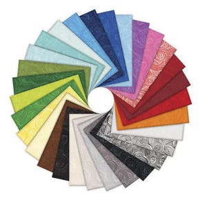May include: A circular arrangement of colorful fabric swatches. The swatches display a variety of colors, including shades of blue, green, red, and neutral tones. Each swatch has a textured pattern, creating a visually appealing display.