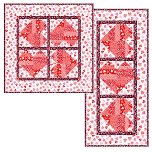 May include: Two red and white patchwork quilt blocks with a heart design. The blocks are surrounded by a white background with small pink hearts. The blocks are framed with a black border.
