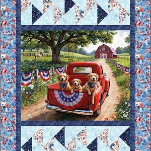 May include: A patriotic quilt featuring a red truck carrying three golden retrievers, with a barn in the background. The quilt has a blue floral border and light blue and navy triangle patterns.