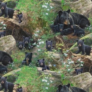 May include: A fabric pattern featuring multiple black bears and cubs in a forest setting with large brown rocks, tree trunks, and small white flowers scattered throughout the green foliage. The bears are depicted in various poses.