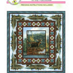 May include: A quilt pattern titled "Northwood" with a central image of a moose in a forest scene. The quilt measures 76" x 82" and includes pressing instructions. The design features a nature theme with a moose, trees, and water.