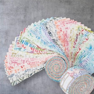 May include: A collection of colorful fabric strips arranged in a fan shape, showcasing various floral and abstract patterns. The fabrics feature a mix of pastel colors, including pink, blue, green, and yellow, ideal for quilting or crafting projects.