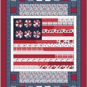 May include: A patriotic quilt featuring an American flag design. The quilt showcases a navy blue field with white and red starbursts, and red and white stripes. The border includes red, white, and blue floral and plaid patterns.