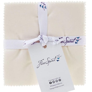 May include: A package of white fabric squares with a Free Spirit Fabrics tag. The tag has the company logo and website information. Connect with us! #freespiritfabrics freespiritfabrics.com