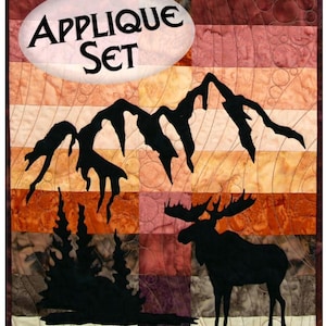 May include: Applique set for quilting, featuring a moose, mountains, and trees in black silhouettes against a colorful background. The title "Applique Set" is displayed in a white oval.