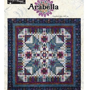 May include: Quilt pattern titled "Arabella" by Wing and a Prayer Design. The pattern features a geometric design with a central starburst motif in shades of blue, purple, and brown. The finished quilt size is 108 inches square.
