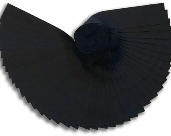 May include: A roll of black fabric, cut into strips, is rolled up and fanned out. The fabric is a dark, solid black color.