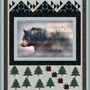 May include: A quilt featuring a black bear silhouette against a faded American flag background. The bear is surrounded by a forest scene. The quilt is bordered by a dark green and burgundy trim with a geometric pattern of triangles. The bottom of the quilt features a row of green pine trees and red paw prints.