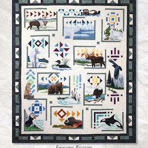 May include: A finished quilt pattern titled "Arctic Swan & Finishing" from The Last Frontier Collection. The quilt features various animal blocks, including a polar bear, moose, and orca, with geometric designs. The quilt measures 73" x 87".