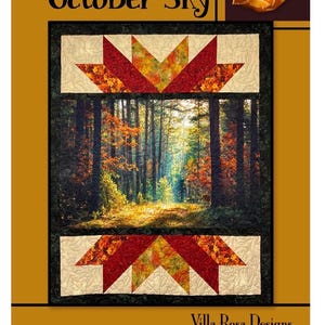 Może przedstawiać: Kołdra z napisem "October Sky" i sceną leśną. Kołdra przedstawia centralny obraz lasu z jesiennymi liśćmi, obramowany wzorami w kształcie gwiazd w kolorach czerwonym, pomarańczowym i kremowym. Projekt autorstwa Villa Rosa Designs.