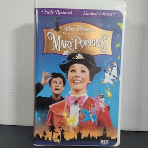 May include: A VHS tape of the Walt Disney Masterpiece, Mary Poppins. The cover features a colourful image of Mary Poppins, Bert, and other characters from the film. The text "Fully Restored" and "Limited Edition" are printed on the top of the cover. The bottom of the cover has the text "THX Certified".