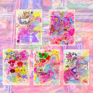 May include: Four colorful, hand-painted cards with a rainbow theme. The cards feature a variety of images, including a cat, a phone, fruit, and a flower. The text on the cards includes "be kind to yourself" and "is your life your own".