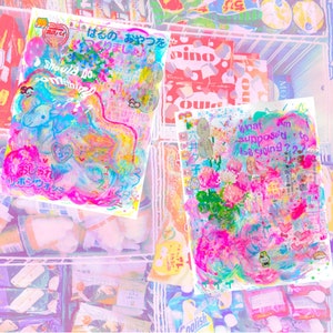 May include: Two colorful, abstract paintings with Japanese text. The text on the left painting says "Should Do Something". The text on the right painting says "What am I supposed to be going??".