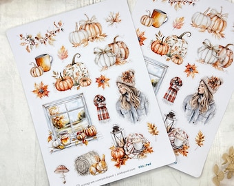 May include: Two sticker sheets featuring fall-themed illustrations. The designs include pumpkins, mugs, autumn leaves, a window scene, a woman in a hat and scarf, and a rabbit. The color palette is warm, with shades of orange, brown, and cream.