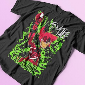 May include: Black t-shirt with a green, red, and white graphic print of a cartoon character with the text "Smile for the Radio" and "Alastor" on the front.
