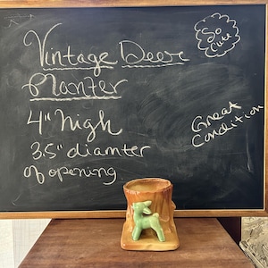 May include: A vintage deer planter, 4 inches high with a 3.5-inch diameter opening. The planter is brown with a green deer figurine. Text on the chalkboard reads "Vintage Deer Planter", "So Cute", and "Great Condition."