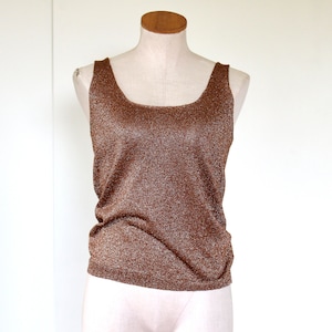 May include: A brown sleeveless top with a sparkly texture. The top has a square neckline and a fitted silhouette.