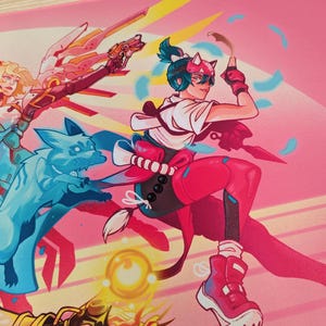The right character has her hair in a ponytail and a headband with cat ears. She’s holding a paper with one hand and a knife with the other.