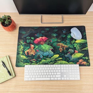 May include: A green, blue, and brown mousepad with a cartoon illustration of a character in a forest setting. The character is wearing a brown hat and holding a green and blue creature. The mousepad has a dark green background with green, blue, and brown foliage.