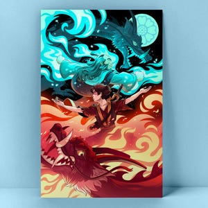 An art print leaning against a blue wall. The illustration is blue on the top and red on the bottom. Both the top and bottom feature a character with flames and a dragon.