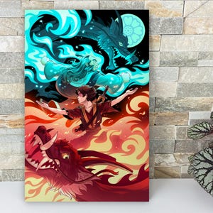 The art print is leaning against a wall on a mantle. There’s a plant next to it. The illustration shows the two figures with red and blue flames.
