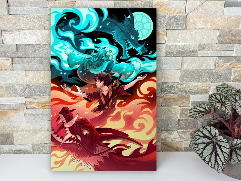 The art print is leaning against a wall on a mantle. There’s a plant next to it. The illustration shows the two figures with red and blue flames.
