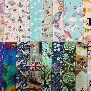 May include: A collection of 20 fabric swatches featuring various patterns and designs. The swatches include floral patterns, geometric patterns, animal prints, and abstract designs. The swatches are arranged in two rows of ten.