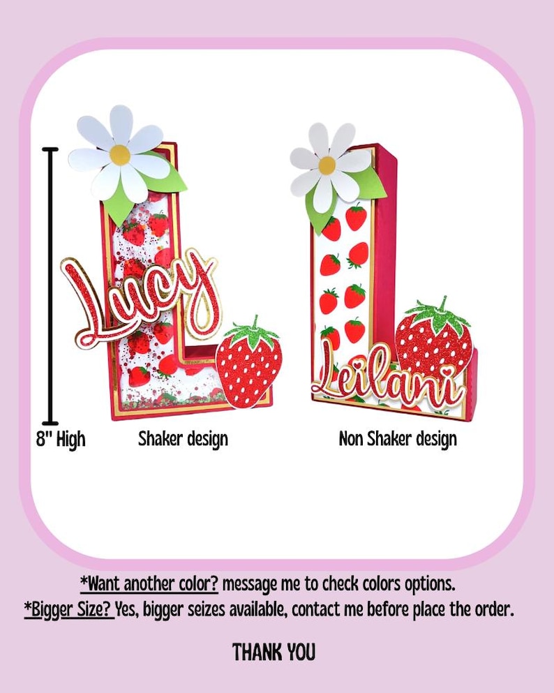 May include: Two 8-inch tall letters, "L" and "L", decorated with a strawberry and daisy theme. The "L" on the left is a shaker design with glitter inside. The "L" on the right is a non-shaker design. Both letters have the names "Lucy" and "Leilani" written on them.