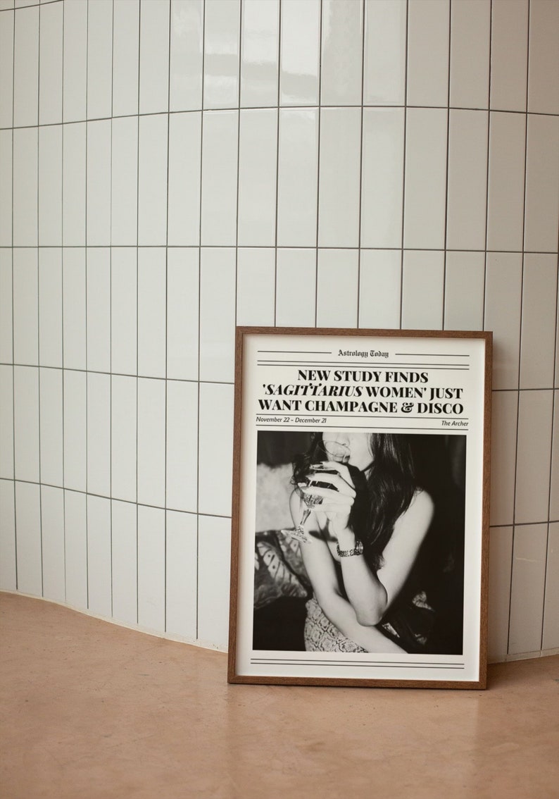 May include: A black and white newspaper print with the headline "NEW STUDY FINDS 'SAGITTARIUS WOMEN' JUST WANT CHAMPAGNE & DISCO" and the text "Astrology Today" and "The Archer". The image shows a woman holding a glass of wine.