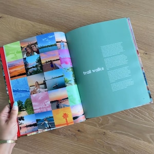 Op de afbeelding: Een open boek met een collage van diverse buiten- en zonsondergangfoto's op de linkerpagina en de tekst "trail walks" in het wit gedrukt op een effen groenblauwe achtergrond op de rechterpagina, met beschrijvende alinea's eronder.