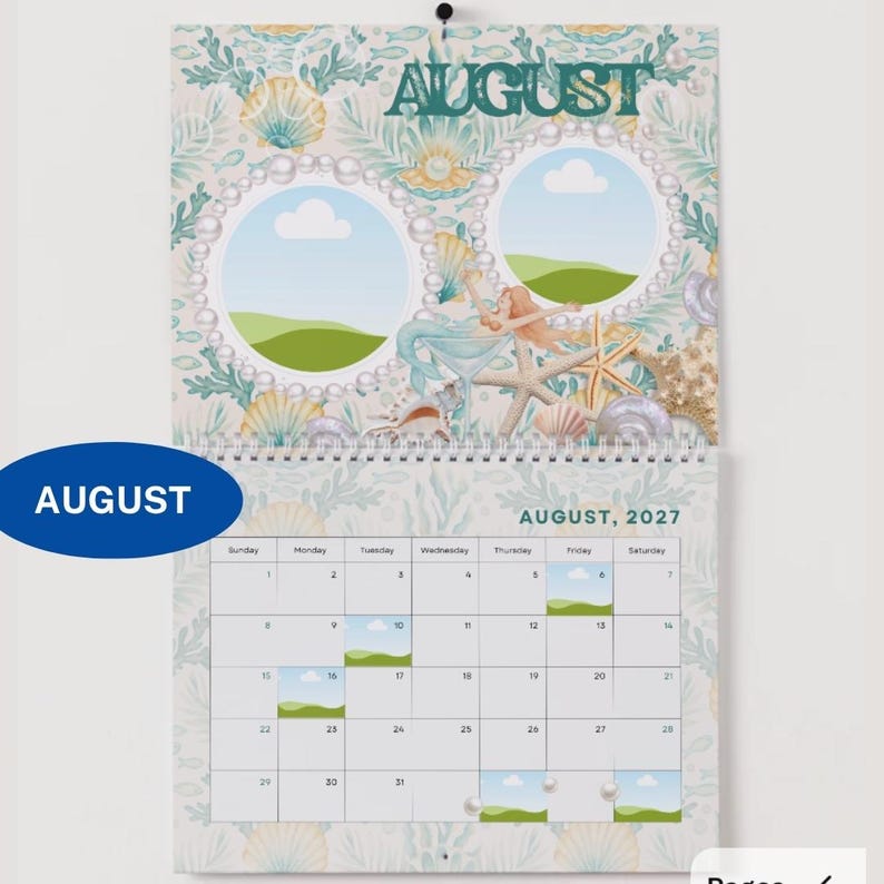 May include: A wall calendar for August 2027 featuring a mermaid theme. The top section displays the word AUGUST in dark green text, two circular photo frames bordered by pearls, seashells, and starfish. The bottom section shows the monthly grid.