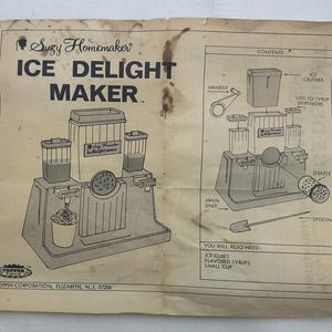 May include: A set of three ceramic mugs with a speckled, matte finish in cream, light grey, and dark grey. Each mug has a simple, minimalist design and a rounded handle.