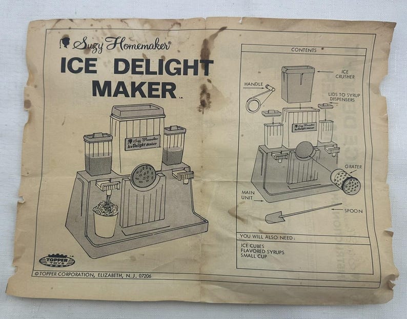 May include: A set of three ceramic mugs with a speckled, matte finish in cream, light grey, and dark grey. Each mug has a simple, minimalist design and a rounded handle.