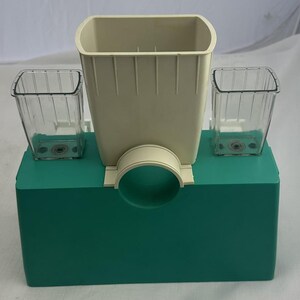 May include: A set of three ceramic mugs with a speckled, matte finish. The mugs are in shades of cream, light grey, and dark grey. Each mug has a simple, minimalist design, ideal for coffee or tea.