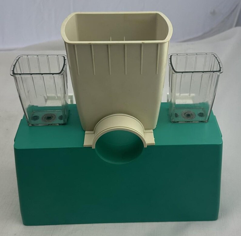 May include: A set of three ceramic mugs with a speckled, matte finish. The mugs are in shades of cream, light grey, and dark grey. Each mug has a simple, minimalist design, ideal for coffee or tea.