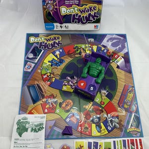 May include: A Marvel Spider-Man and Friends "Don't Wake Hulk" board game. The game includes a game board, Hulk figure, cards, and game pieces. The box features the Hulk character and the game's title.