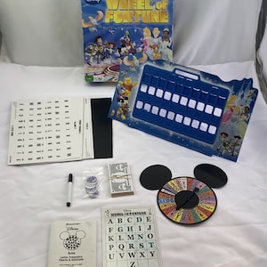 May include: A Disney Wheel of Fortune board game with a blue game board, a spinning wheel, and a set of letter tiles. The game features characters from Disney movies, including Mickey Mouse, Winnie the Pooh, and Cinderella.