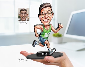 May include: A custom caricature figurine of a runner wearing a green tank top with the number one and blue shorts. The figure has brown hair and glasses, is mounted on a black oval base with the name ALEX printed on it, and includes a photo reference.