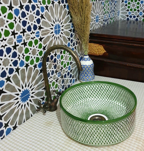 A hand-thrown Moroccan ceramic basin with bold geometric zellige-style patterns — an instant statement piece that turns a kitchen or bathroom into a design moment.