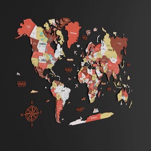 May include: A wooden world map in red, yellow, and brown against a black backdrop. The map features labeled continents and oceans, with decorative airplane and boat cutouts. A compass rose is in the lower left corner.