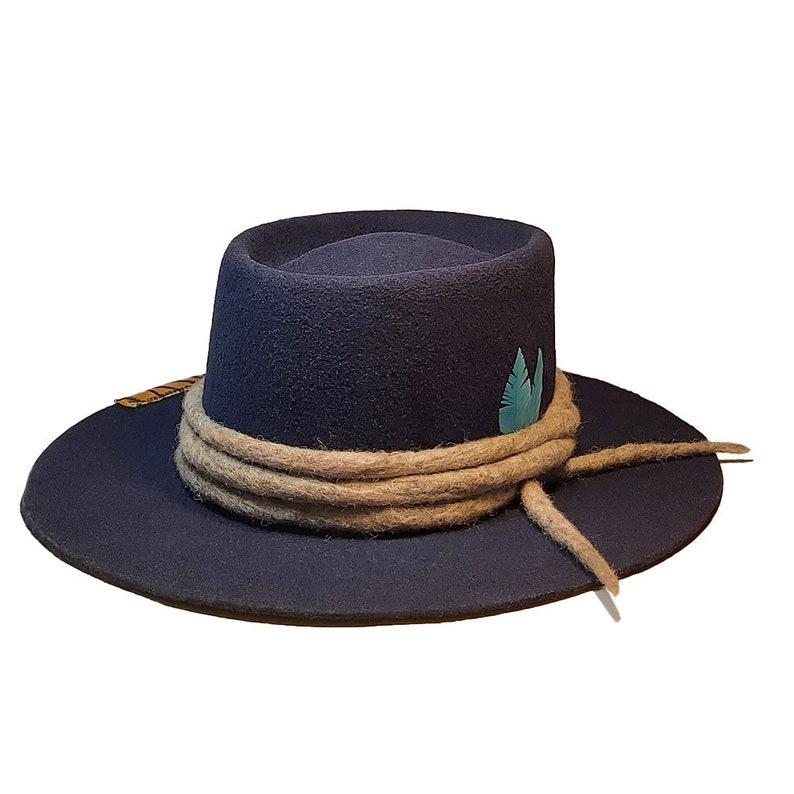 May include: A navy blue fedora hat with a wide brim and a tan rope band. The hat has a teal feather accent.