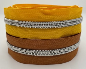 Zipper Silver Star, yellow or brown, wide / metallized endless zipper with spiral bead / sold by the meter