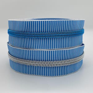 Zipper Stripes, wide, light blue-white, silver or blue caterpillar / Continuous zipper with metallized plastic caterpillar / Sold by the meter