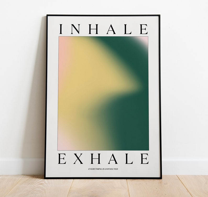 May include: A framed art print with the words "INHALE" and "EXHALE" in black, centered at the top and bottom. The artwork features a blurred gradient of colors, including yellow, green, and pink. The text "EVERYTHING IS CONNECTED" is below "EXHALE".